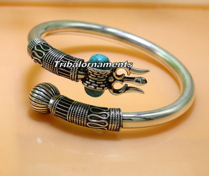 Sterling silver turquoise stone Shiva bangle cuff bracelet, handmade unisex jewelry with intricate tribal design and custom details.