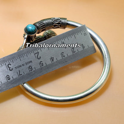 Sterling silver Shiva bangle cuff with turquoise stone from Tribal Ornaments, unisex handmade jewelry, detailed tribal design.