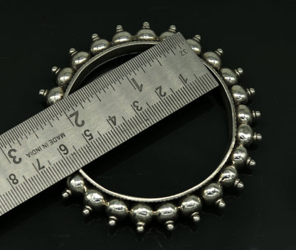 Sterling silver handmade vintage bangle bracelet with intricate tribal design, ideal for weddings or personalized jewelry gifts.