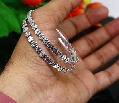 Sterling silver floral design bangle bracelet by TRIBAL ORNAMENTS, handmade silver jewelry for brides and gifting.