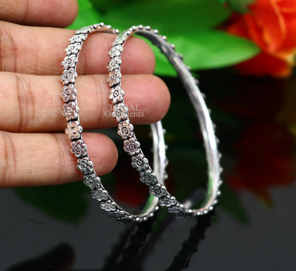 Sterling silver floral bangle bracelet by TRIBAL ORNAMENTS featuring intricate handmade design, perfect for bridal silver jewelry.