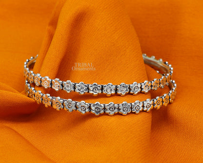 Sterling silver floral bangle bracelet by Tribal Ornaments, showcasing intricate handmade design perfect for bridal jewelry gifting.
