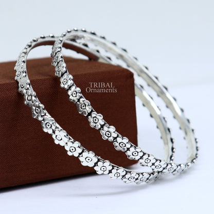 925 sterling silver floral bangle bracelet by TRIBAL ORNAMENTS, showcasing intricate handmade floral design for elegant jewelry gifting.