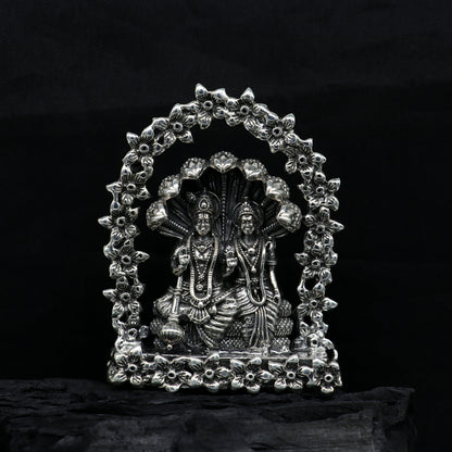 925 Sterling silver Indian idol figurine of Laxmi and Vishnu with snake, floral design, perfect for puja and decorative gifting.