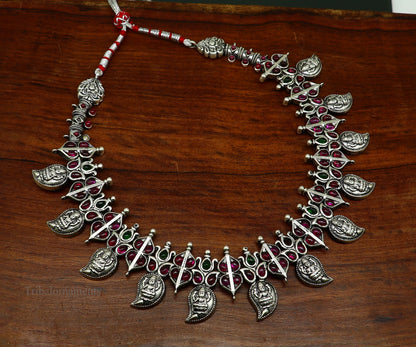 Sterling silver Goddess Laxmi necklace with cut stone work, handcrafted tribal jewelry set for brides and wedding occasions.