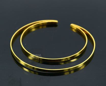Sterling silver handmade gold polished double-layer bangle bracelet, tribal belly dance jewelry from India with intricate design.