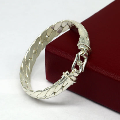Bright shining 925 sterling silver bangle bracelet from Tribal Ornaments, showcasing a handmade, unisex, personalized jewelry design.