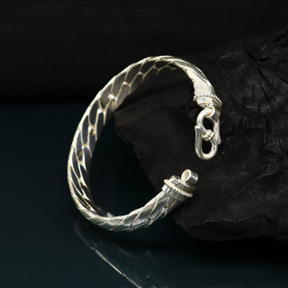 Sterling silver bangle bracelet by TRIBAL ORNAMENTS, shining handmade jewelry, unisex design for personalized gift or everyday wear.