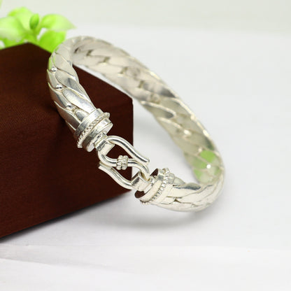 Sterling silver bangle bracelet by Tribal Ornaments, shiny handmade unisex jewelry, perfect as a personalized gift or fashion accessory.