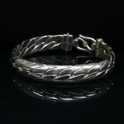 Bright shining 925 sterling silver bangle bracelet by Tribal Ornaments, featuring a handmade, unisex design for personalized gifting.