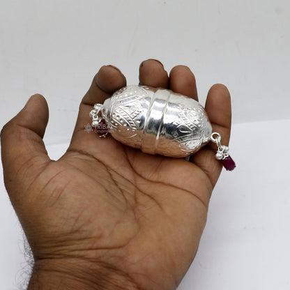 Handmade 925 sterling silver coconut for puja, decorative silver nariyal for Diwali worship, featuring intricate tribal design.