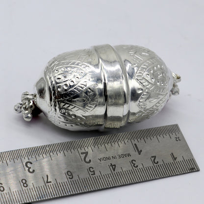 Handmade 925 sterling silver coconut ornament for puja and Diwali worship, featuring intricate tribal design by Tribal Ornaments.