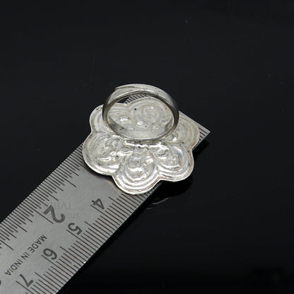 Sterling silver handmade flower-shaped adjustable ring by TRIBAL ORNAMENTS, featuring tribal ethnic design, unisex jewelry band.