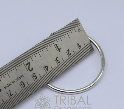 Sterling silver Lord Shiva trident baby bangle bracelet, handmade unisex tribal jewelry with intricate tribal ornament design.
