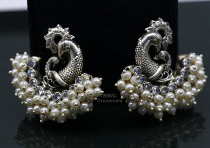 Sterling silver peacock design stud earring with cut stone and pearl, handmade tribal jewelry by TRIBAL ORNAMENTS.