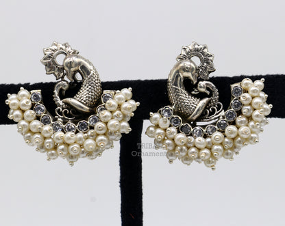 Sterling silver peacock design stud earring with cut stone and pearl, handmade tribal jewelry by TRIBAL ORNAMENTS.