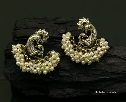 Sterling silver peacock design stud earring with pearl stone, handmade tribal jewelry by TRIBAL ORNAMENTS.
