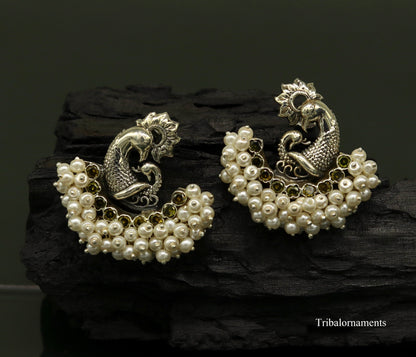 Sterling silver peacock design stud earring with pearl stone, handmade tribal jewelry by TRIBAL ORNAMENTS.