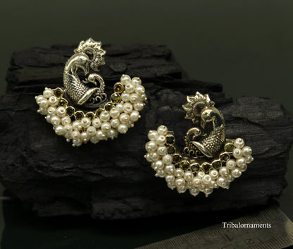 Sterling silver handmade peacock design stud earring with a pearl stone, tribal jewelry by TRIBAL ORNAMENTS.