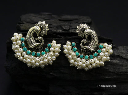 Sterling silver peacock design stud earring with turquoise and pearl accents, handmade tribal jewelry by TRIBAL ORNAMENTS.