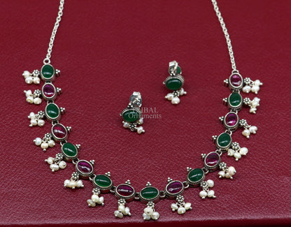 Sterling silver necklace with red and green stones, pearls, and intricate design, perfect for weddings and brides from Tribal Ornaments.