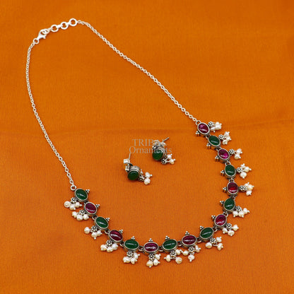 Sterling silver necklace with red and green stones, pearls, and charm, crafted by TRIBAL ORNAMENTS for wedding or bridal jewelry.