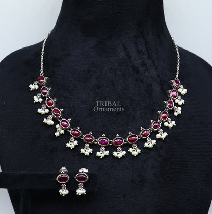 Sterling silver vintage necklace with red stone and pearls, featuring intricate design, perfect for wedding or bridal jewelry.