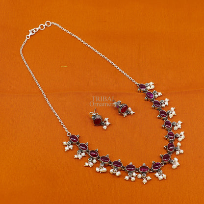 Sterling silver vintage necklace with red stone and pearls, stylish wedding jewelry set featuring intricate charm details.
