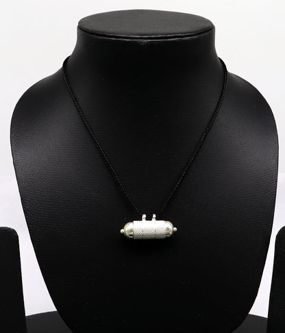 Handmade 925 sterling silver round amulet box pendant with tribal mantra design, featuring detailed craftsmanship and tribal jewelry style.