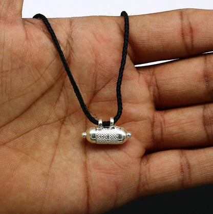 Handmade 925 silver round amulet box pendant with tribal design, mantra box, and silver tabiz, showcasing intricate tribal jewelry craftsmanship.