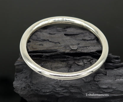 Sterling silver adjustable bangle bracelet by TRIBAL ORNAMENTS featuring a shiny, handmade design for girls jewelry gift.