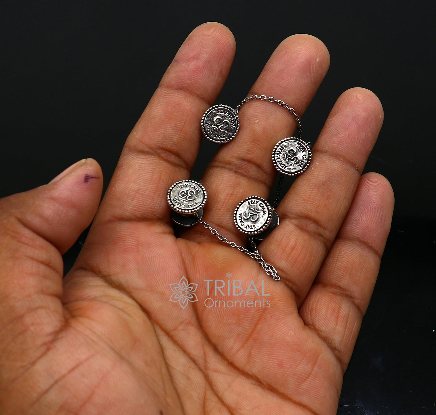 Sterling silver handmade Aum (Om) design cufflinks or buttons by TRIBAL ORNAMENTS, featuring intricate tribal jewelry craftsmanship.