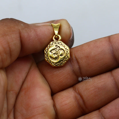 Sterling silver Hindu mantra Aum OM pendant with gold polish, featuring intricate design and good luck symbolism in jewelry style.