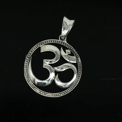Sterling silver OM mantra pendant by TRIBAL ORNAMENTS, unisex Hindu jewelry featuring intricate tribal design and personalized style.