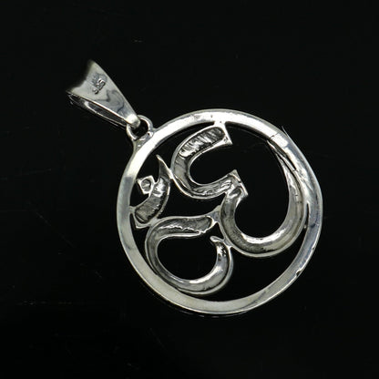 Sterling silver OM mantra pendant by TRIBAL ORNAMENTS, unisex handcrafted Hindu jewelry with intricate tribal design.