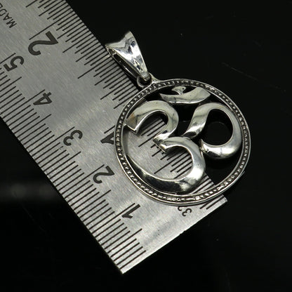 Sterling silver OM mantra pendant by Tribal Ornaments, unisex Hindu jewelry with intricate handmade tribal design.