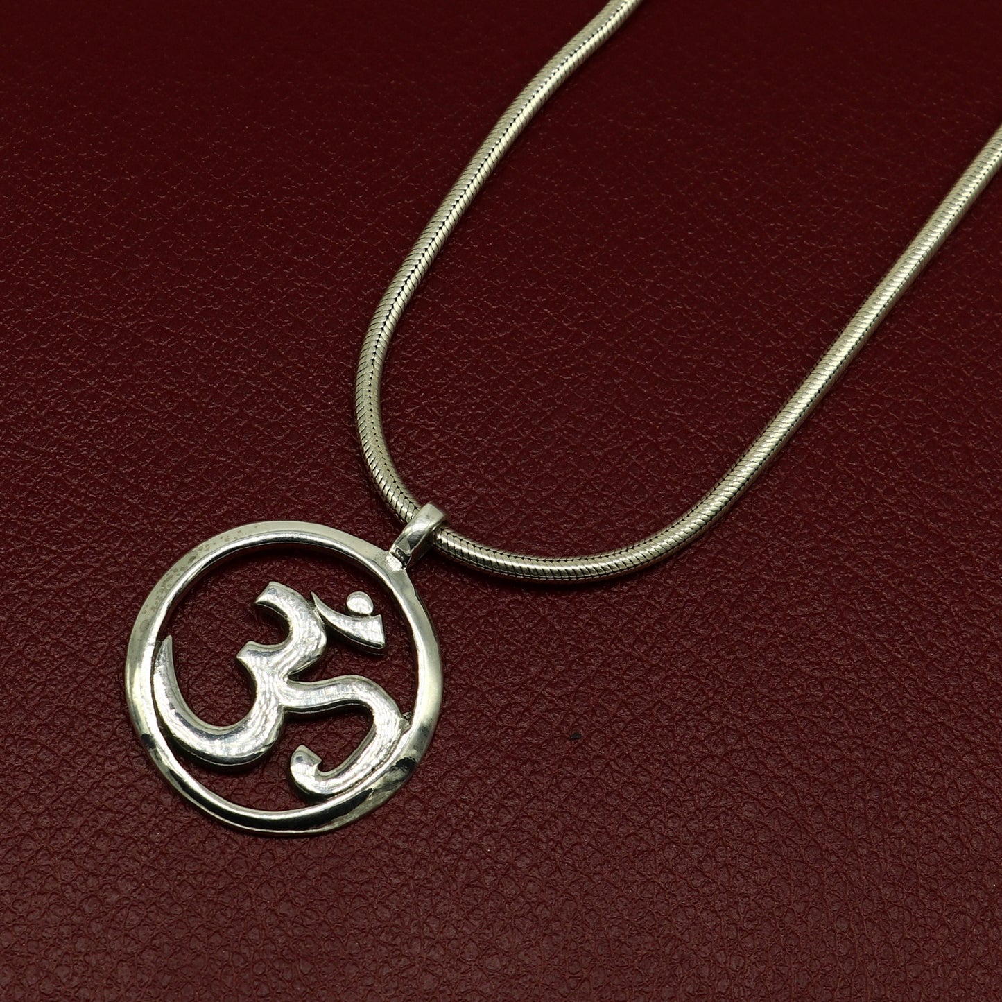 Sterling silver Hindu mantra 'Aum' OM pendant, unisex tribal jewelry, handmade and stylish, featuring intricate tribal design details.