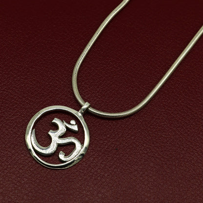 Sterling silver Hindu mantra 'Aum' OM pendant, unisex tribal jewelry, handmade and stylish, featuring intricate tribal design details.