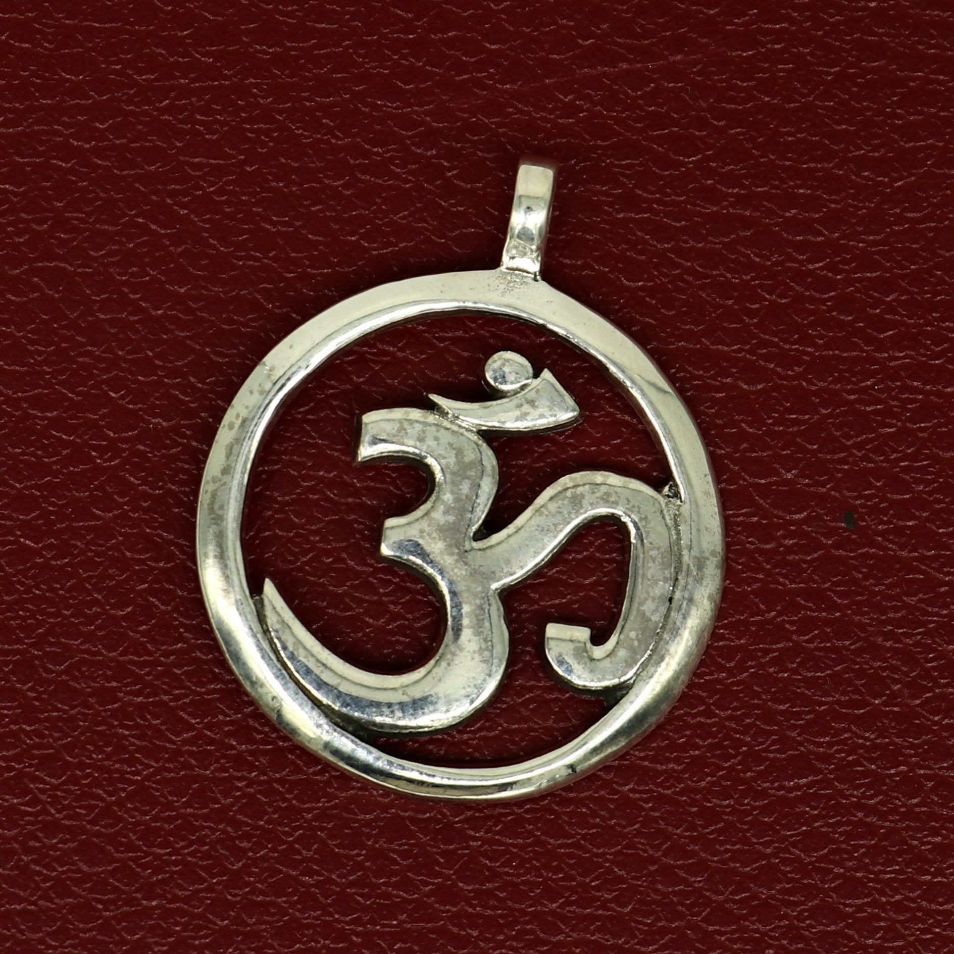 925 sterling silver Hindu mantra 'Aum' OM pendant, stylish unisex jewelry with intricate tribal design, handmade by TRIBAL ORNAMENTS.
