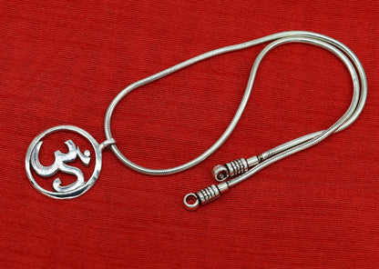 Sterling silver Hindu mantra OM pendant, unisex jewelry featuring handcrafted tribal design and intricate detailing.