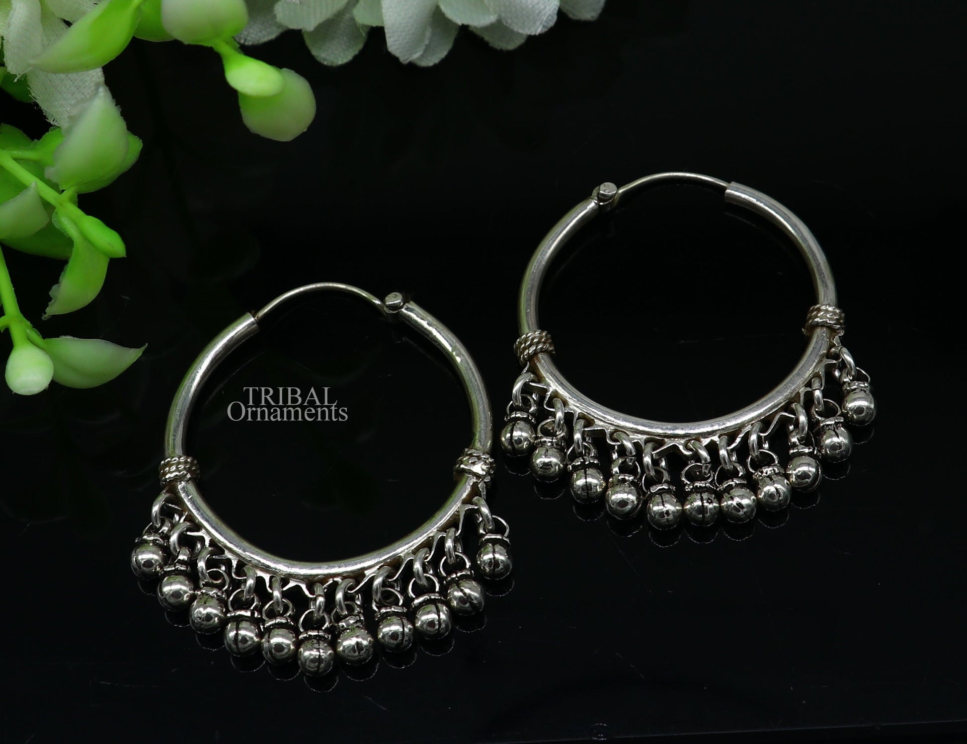 Sterling silver handmade hoop earring with Bali-style hanging bells and hook, tribal-inspired custom jewelry by TRIBAL ORNAMENTS