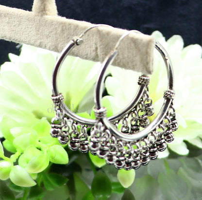 925 sterling silver handmade hoop earring with hanging bells, tribal design, hook style, crafted in Bali by TRIBAL ORNAMENTS.