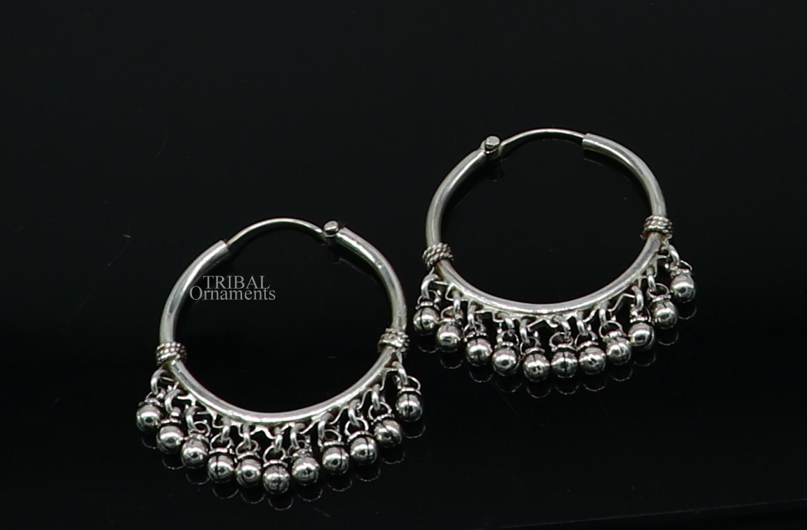 925 sterling silver handmade hoop earring with hanging bells and hook, featuring tribal design in Bali style by TRIBAL ORNAMENTS.