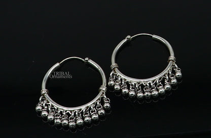 925 sterling silver handmade hoop earring with hanging bells and hook, featuring tribal design in Bali style by TRIBAL ORNAMENTS.
