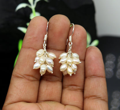 Sterling silver handmade hoop earrings with tiny freshwater pearl, perfect for bridesmaids, by TRIBAL ORNAMENTS.