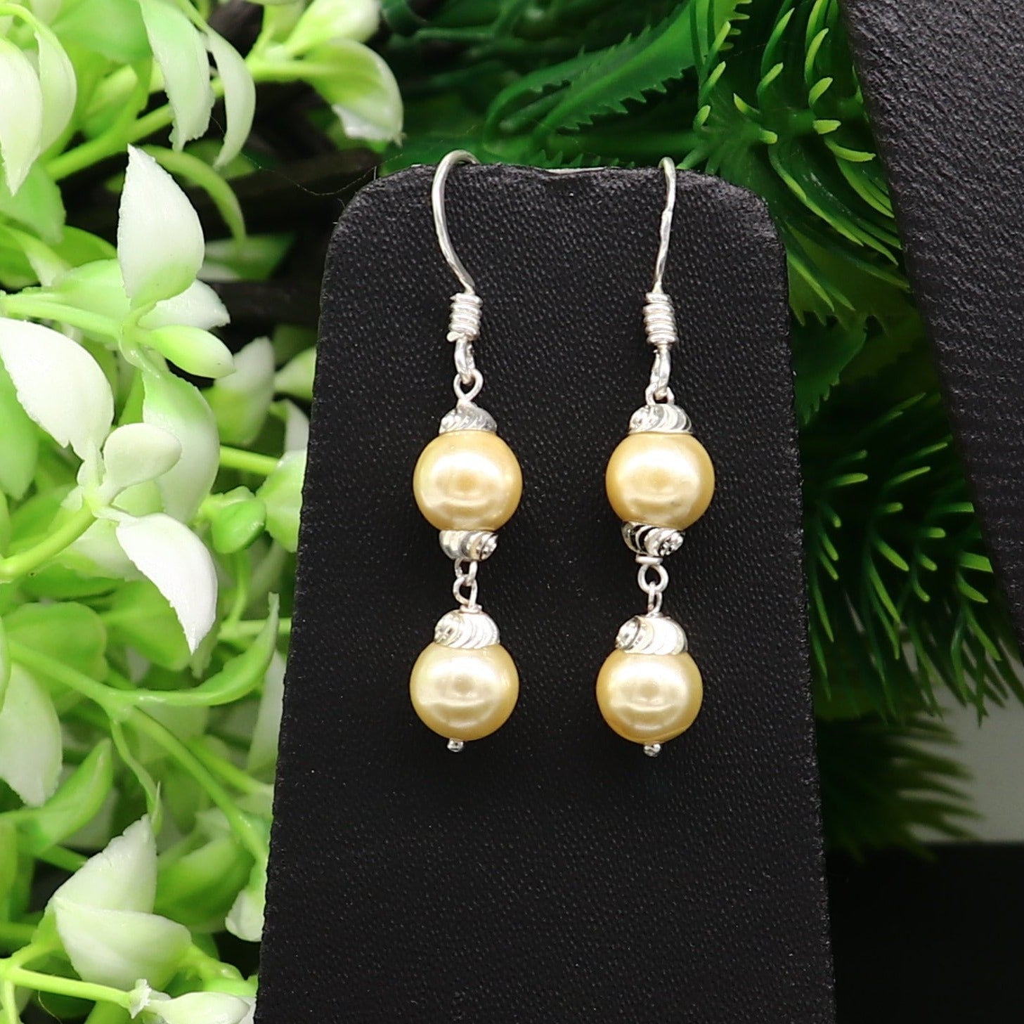 Sterling silver handmade hoop earrings with dangling pearls, perfect for bridesmaids and special occasions by Tribal Ornaments.