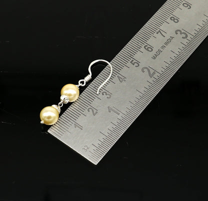 Handmade 925 sterling silver hoop earrings with dangling pearls, perfect for bridesmaids or special occasions, by Tribal Ornaments.