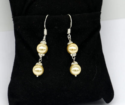 Sterling silver handmade hoop earrings with dangling pearls, perfect for bridesmaids and special occasions, by TRIBAL ORNAMENTS.