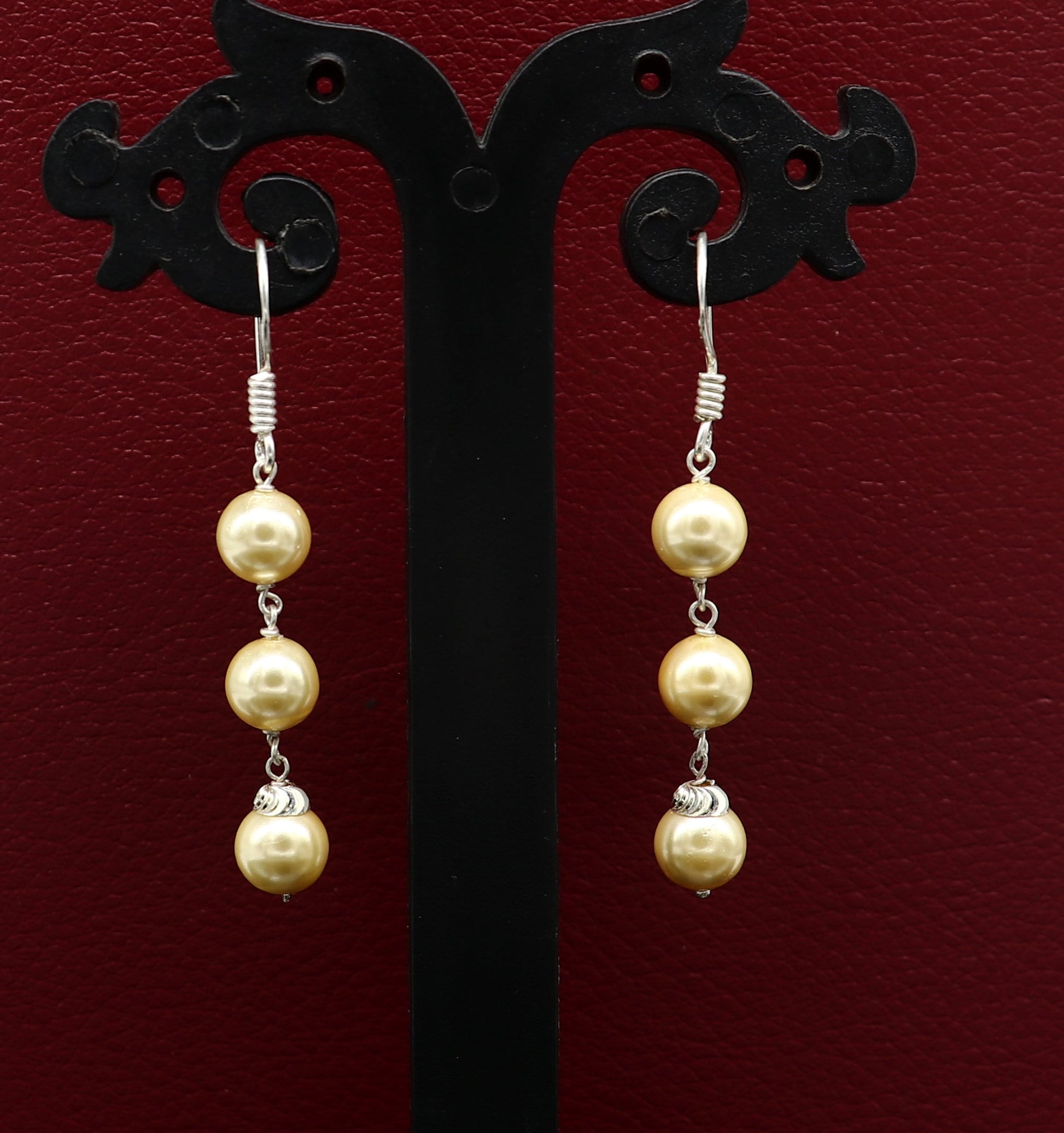 Sterling silver handmade hoop earrings with dangling pearls, perfect as bridesmaid jewelry or elegant drop earrings.