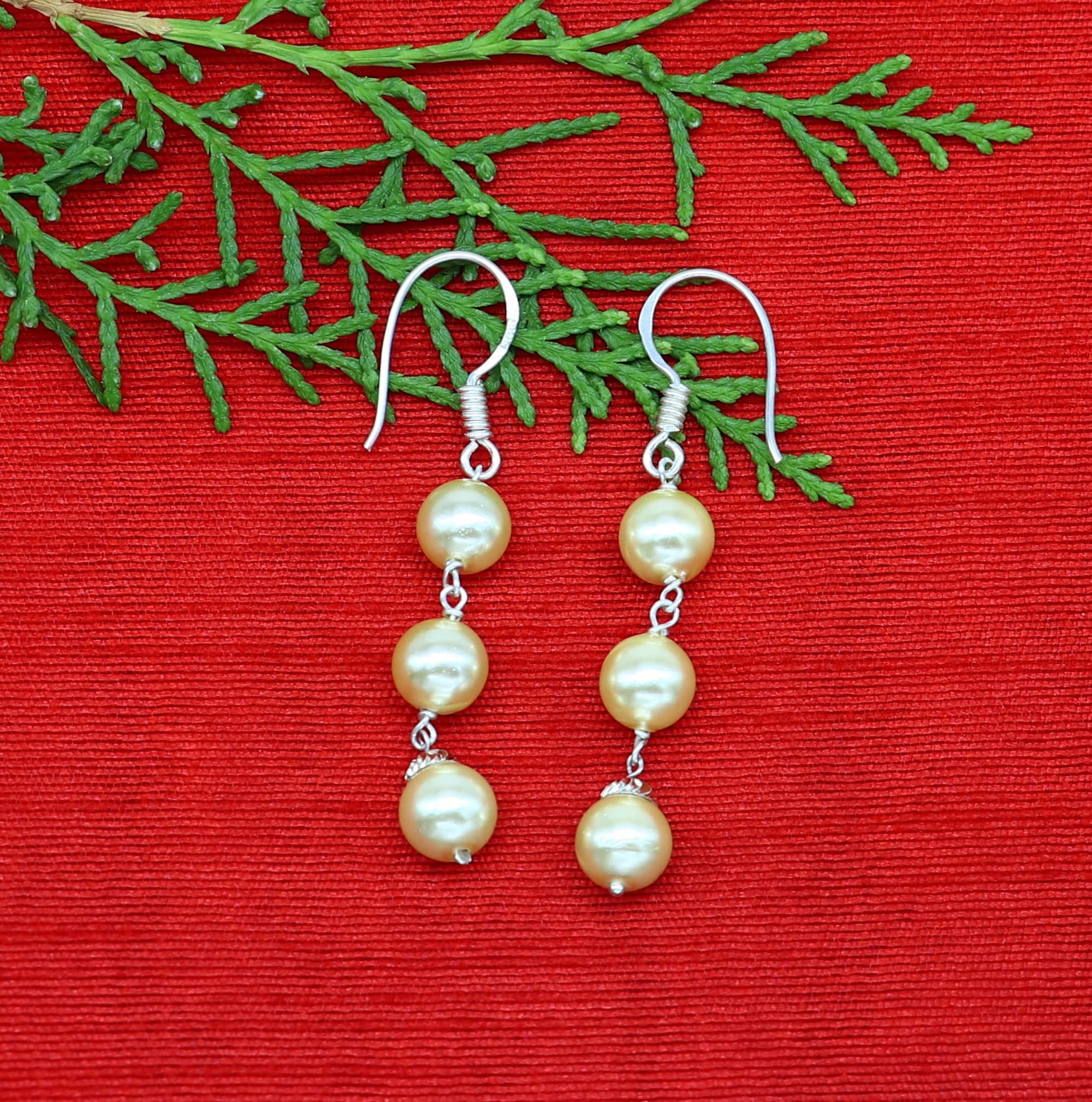 Sterling silver handmade hoops with dangling pearls, drop earrings for bridesmaids, custom hook design by Tribal Ornaments.